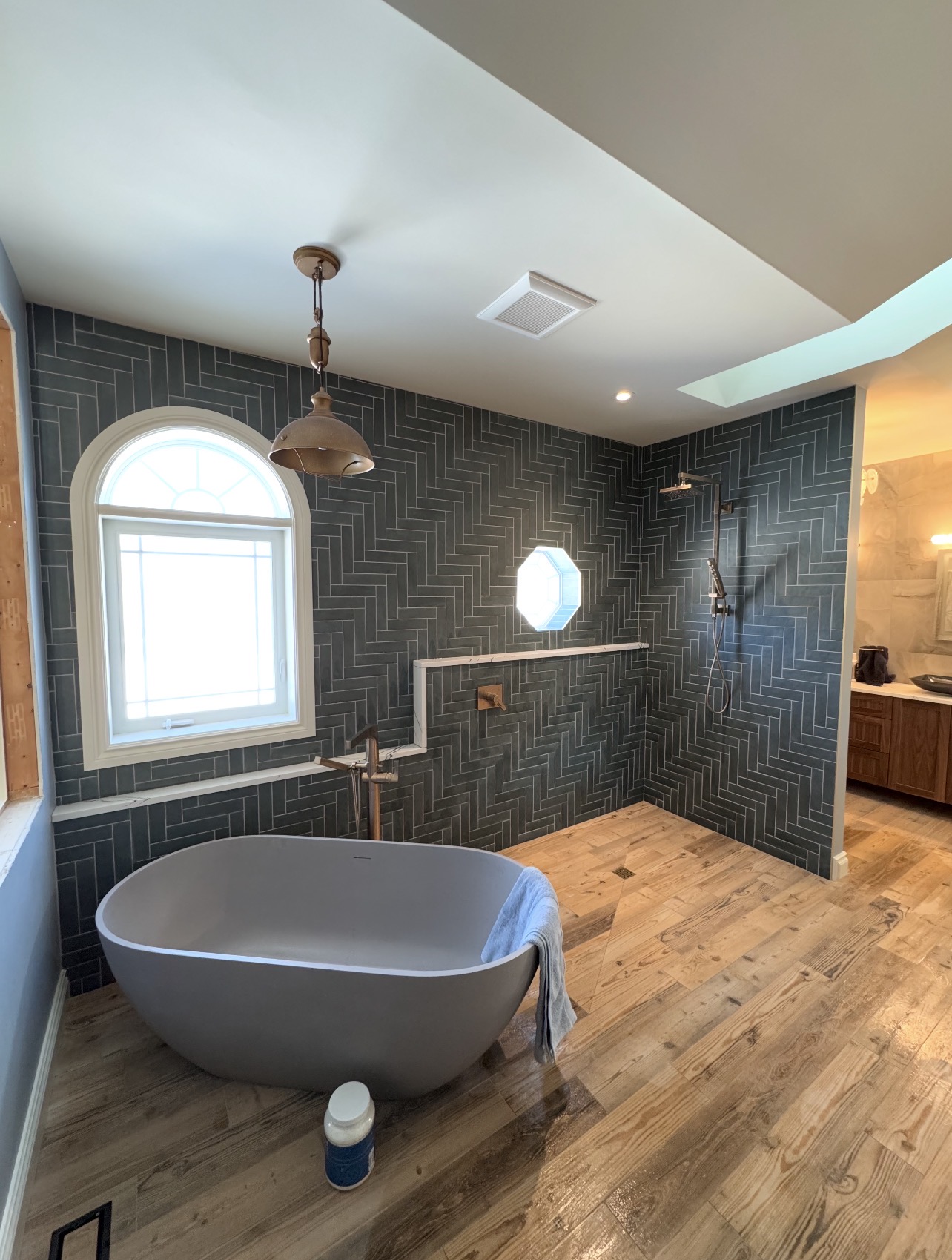 Luxury bathroom with marble column tile and 3D feature wall, Ottawa tile installation